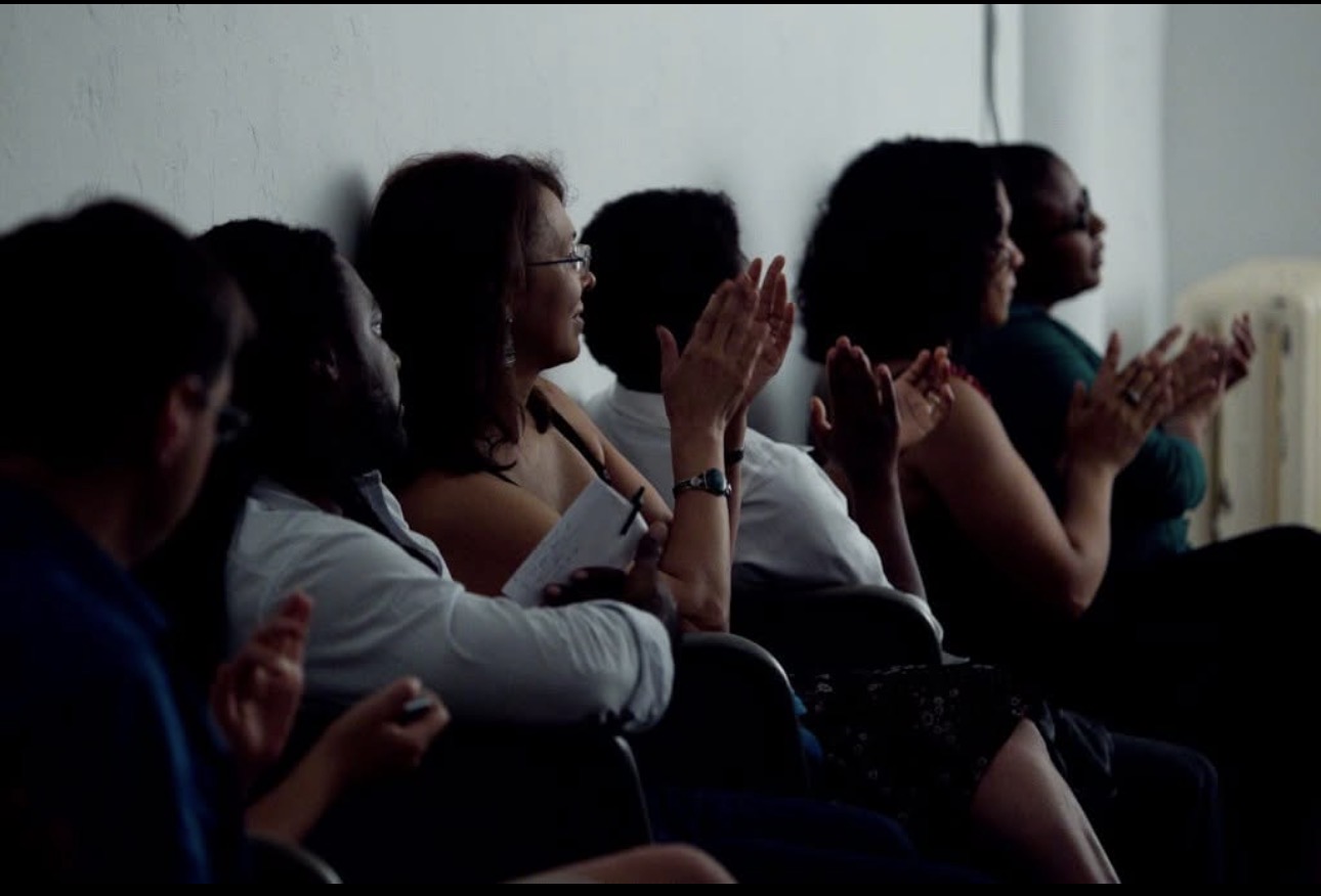 Audience members applauding at a BGHRA gathering